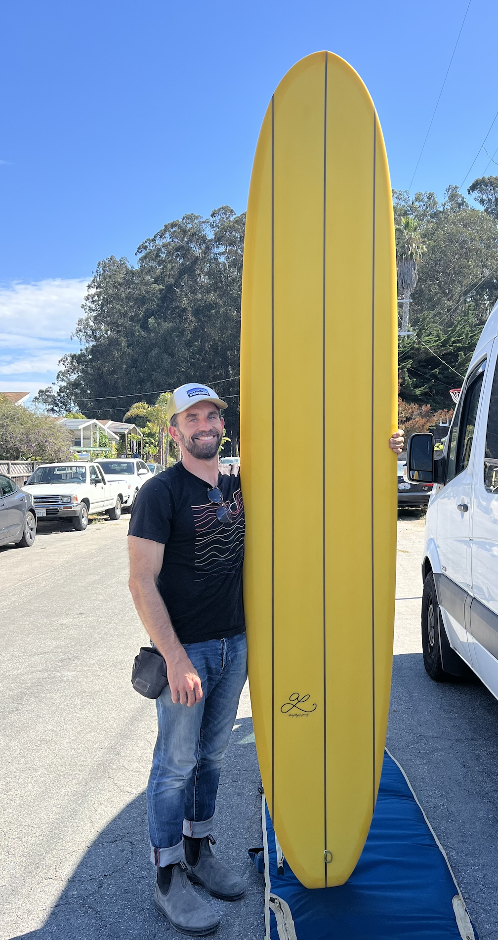 Adam with surfboard